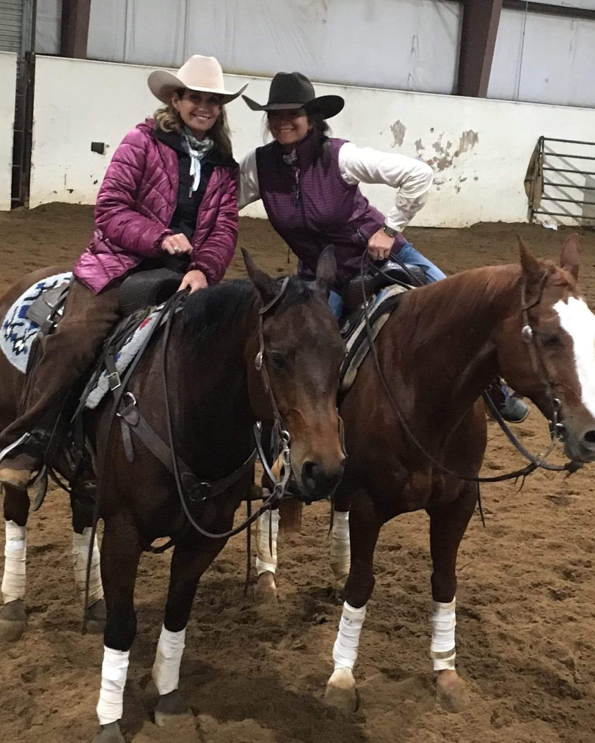 Amy riding Rio and Angie riding Frank together in the arena