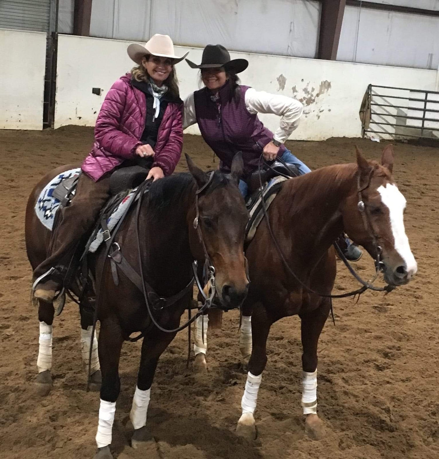 Amy riding Rio and Angie riding Frank together in the arena
