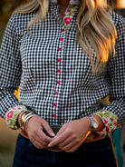 Close up of gingham check shirt with hummingbird damask accent print.
