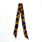 Leopard Twilly laid flat on white background showing full length warm-toned leopard print