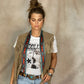 Nashville Twilly draped around neck over fringe vest, Dolly Parton tee, and silver concho belt