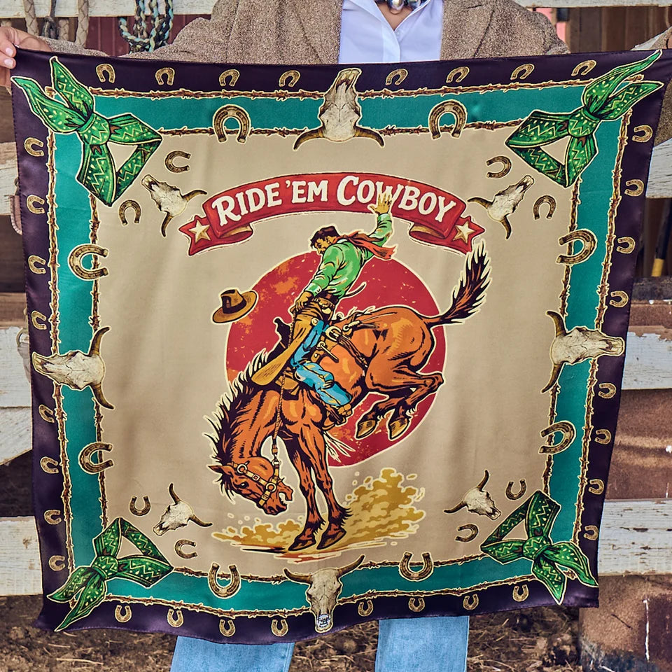 Ride Em Cowboy Wild Rag held outstretched showing full bucking horse design in black, jade, and cream