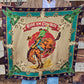Ride Em Cowboy Wild Rag held outstretched showing full bucking horse design in black, jade, and cream