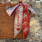 Sweetheart of the Rodeo Twilly in Vintage Red held outstretched showing full length double-sided design