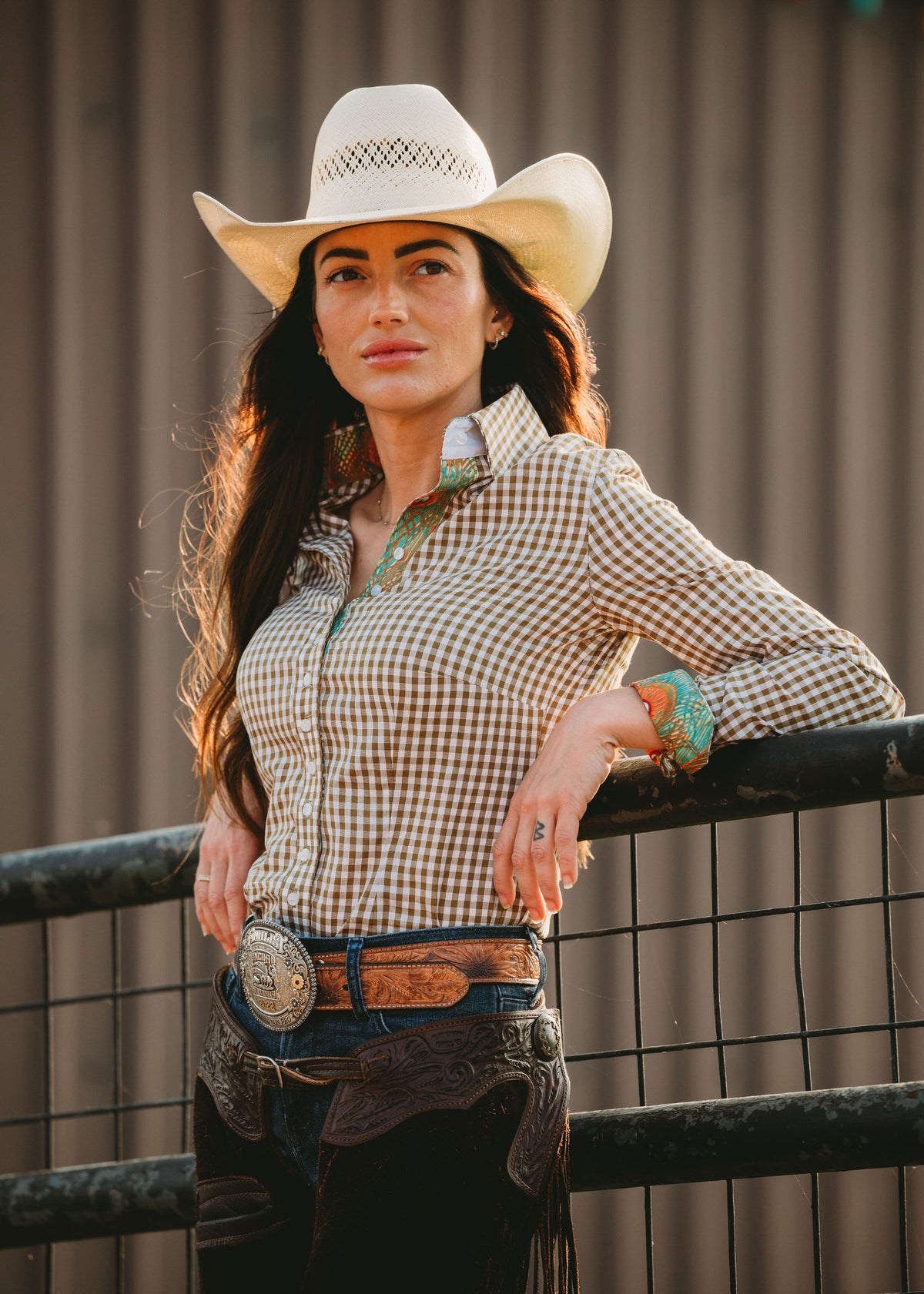 Woman wearing an olive gingham Core western shirt with a printed collar and cuffs