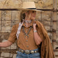 Cross Me Twilly in Tan draped around neck styled with straw hat and fringe jacket
