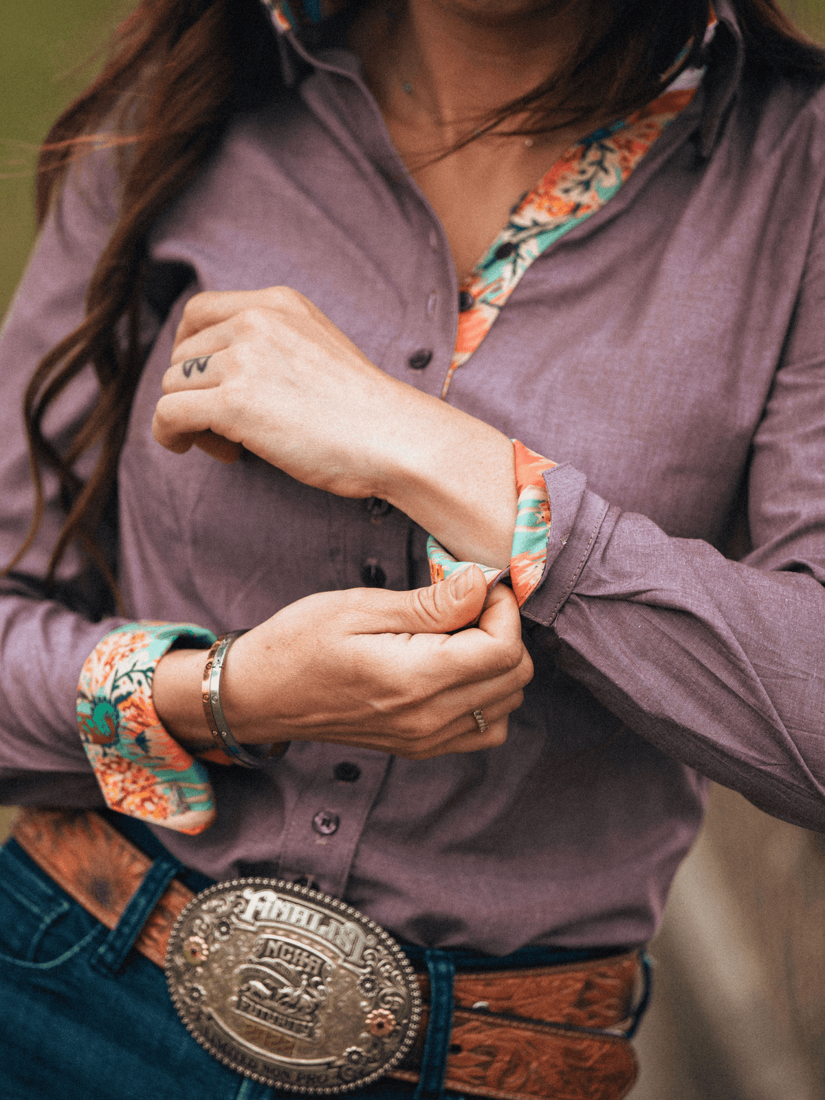 Turn back cuff detail of Tailored brown chambray western show shirt designed to prevent gaping
